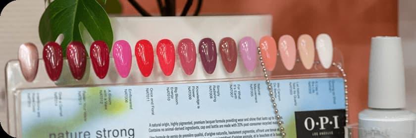 Nail polish color samples showing various shades of red and pink